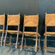Four straw chairs
