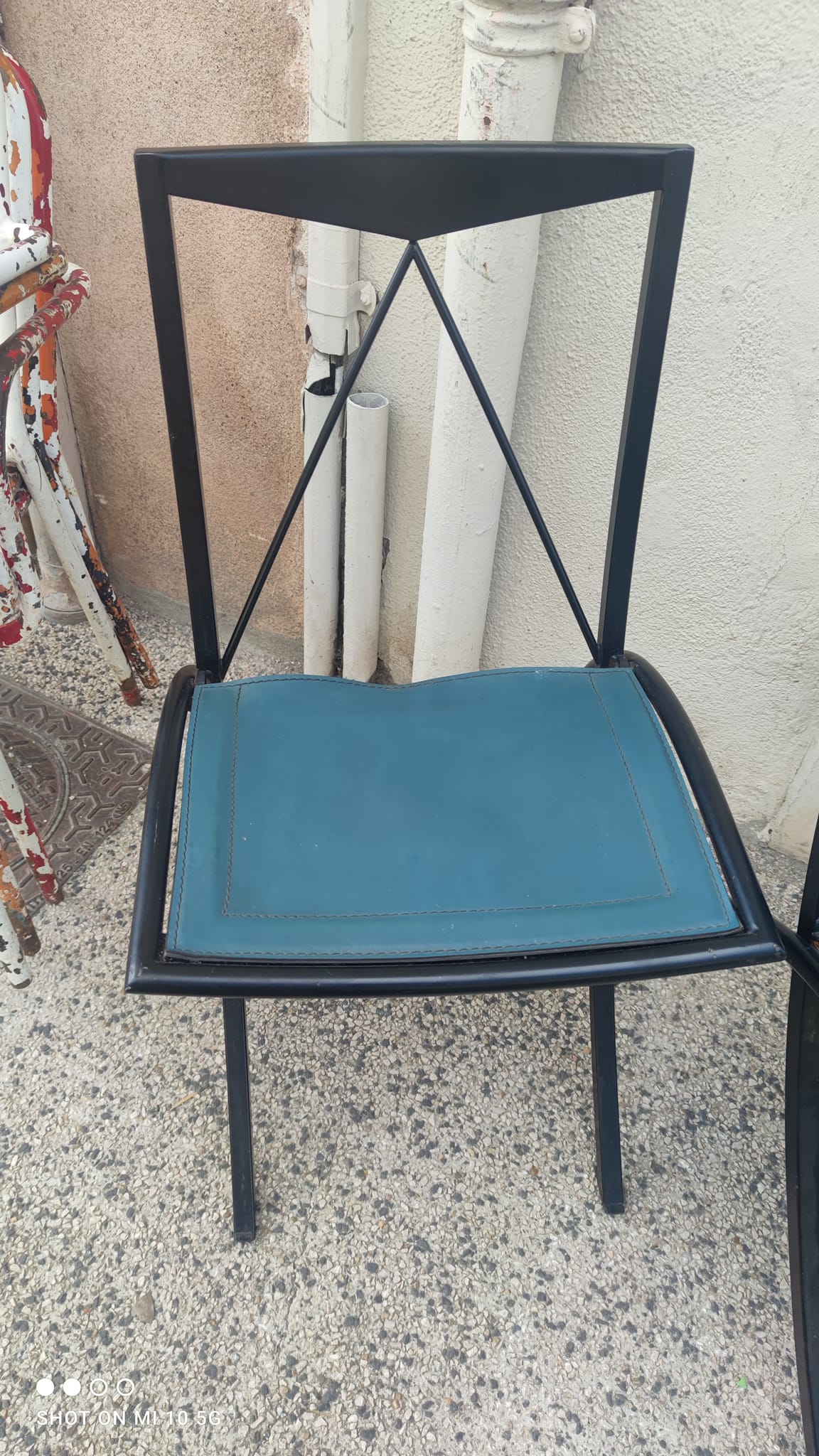5 Bella folding chairs in steel and petrol blue leather by Maison Cattelan