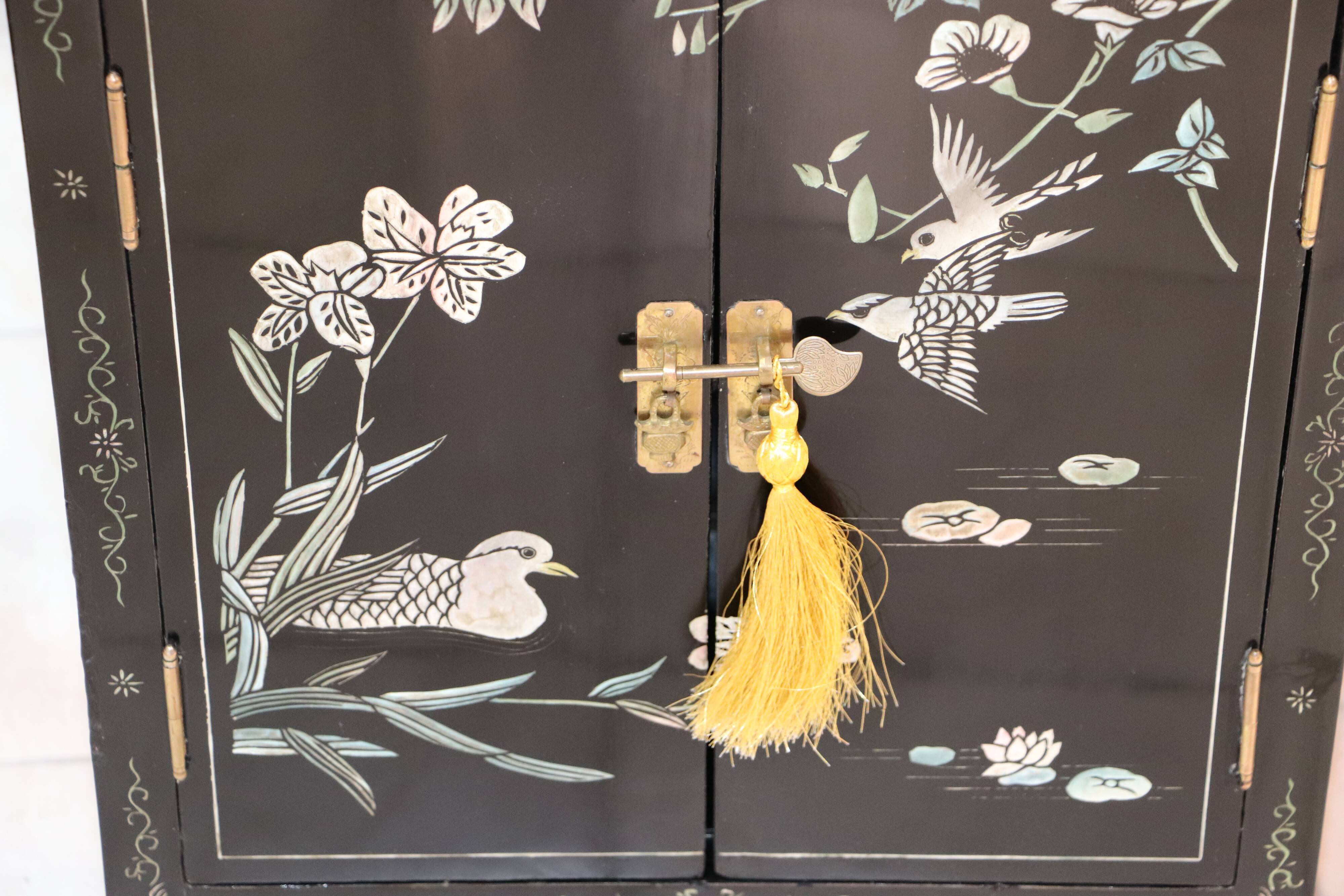 Small storage or bedside table lacquered black, incised and painted