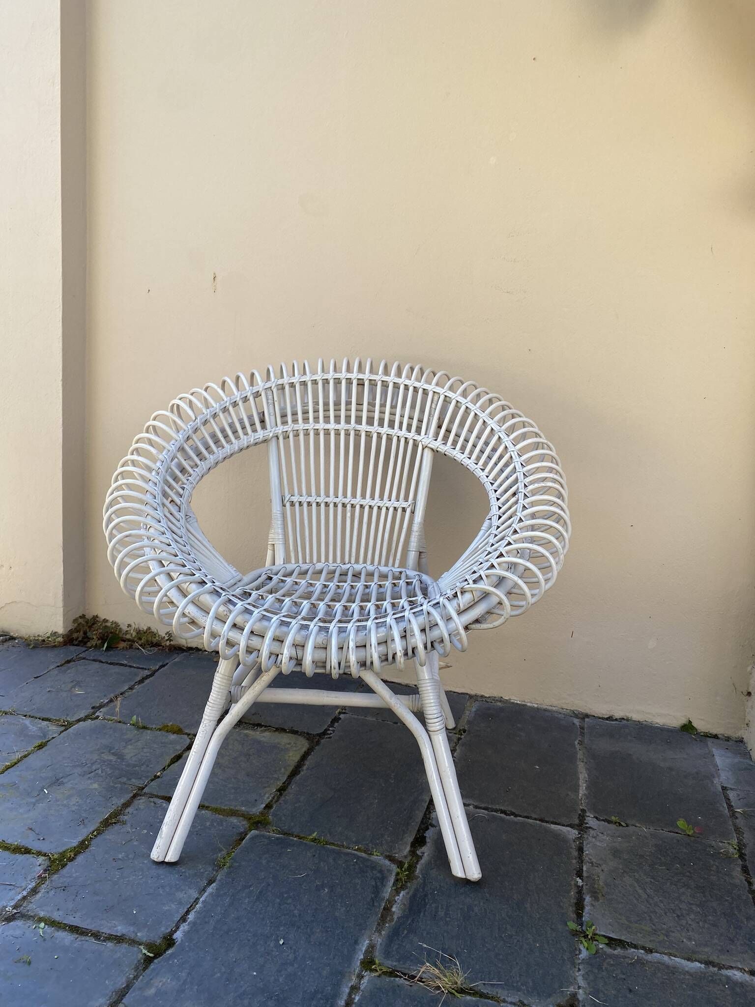 Vintage white rattan armchair