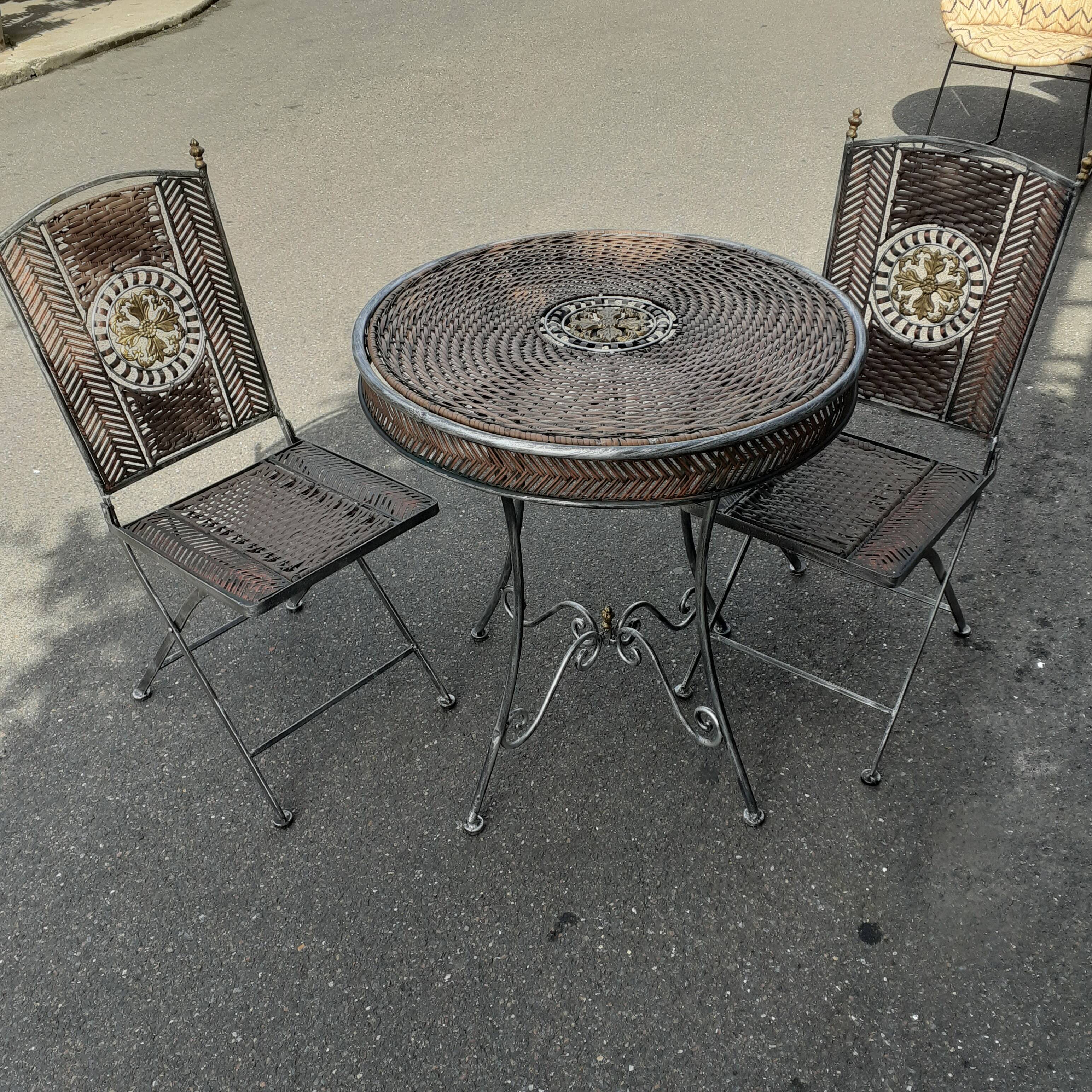 Garden furniture in rattan and wrought iron