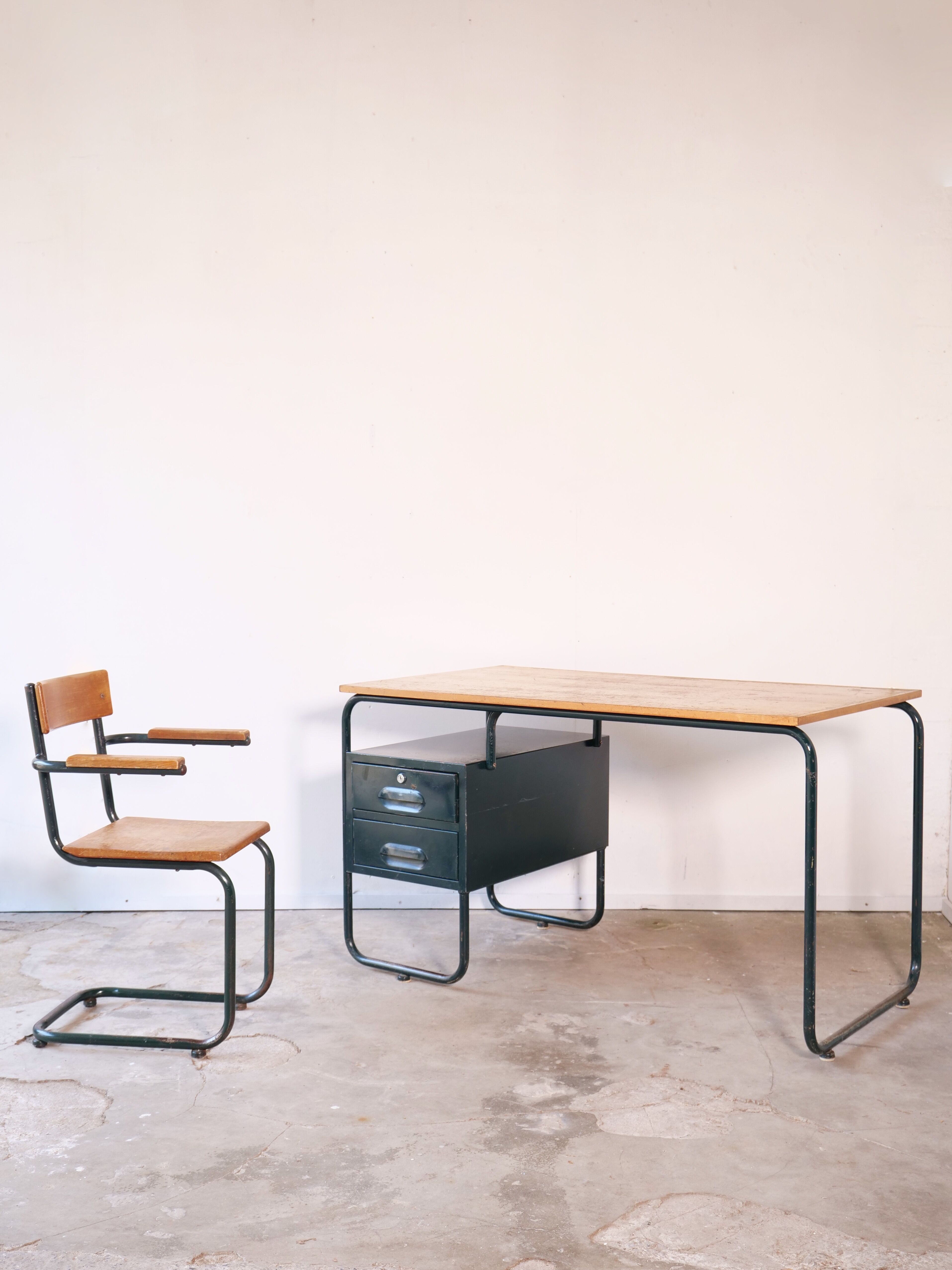 Desk with bauhaus style tubular steel chair