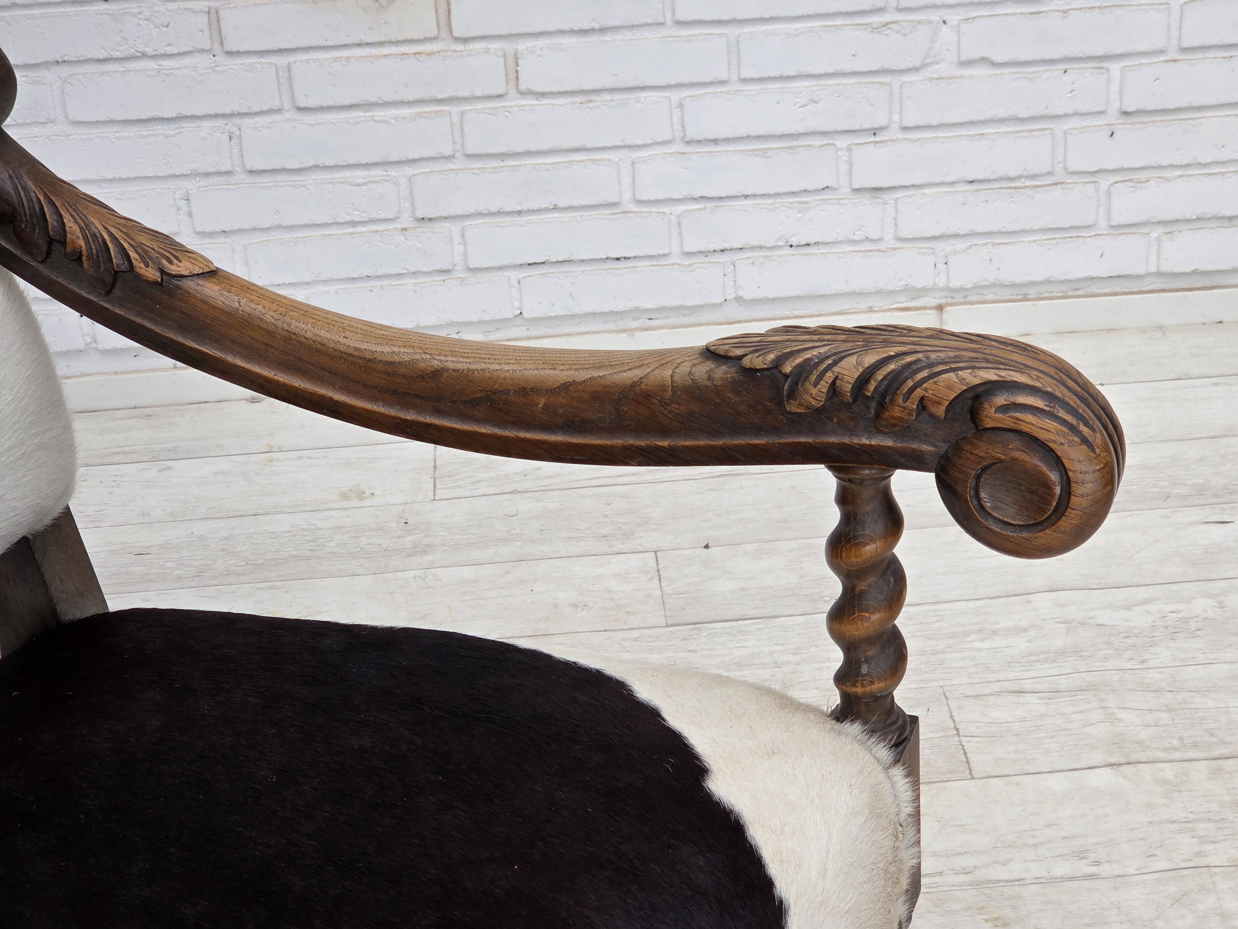 1950s, Danish highback armchair, genuine cowhide, oak wood.