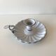 Candlestick in white enameled metal