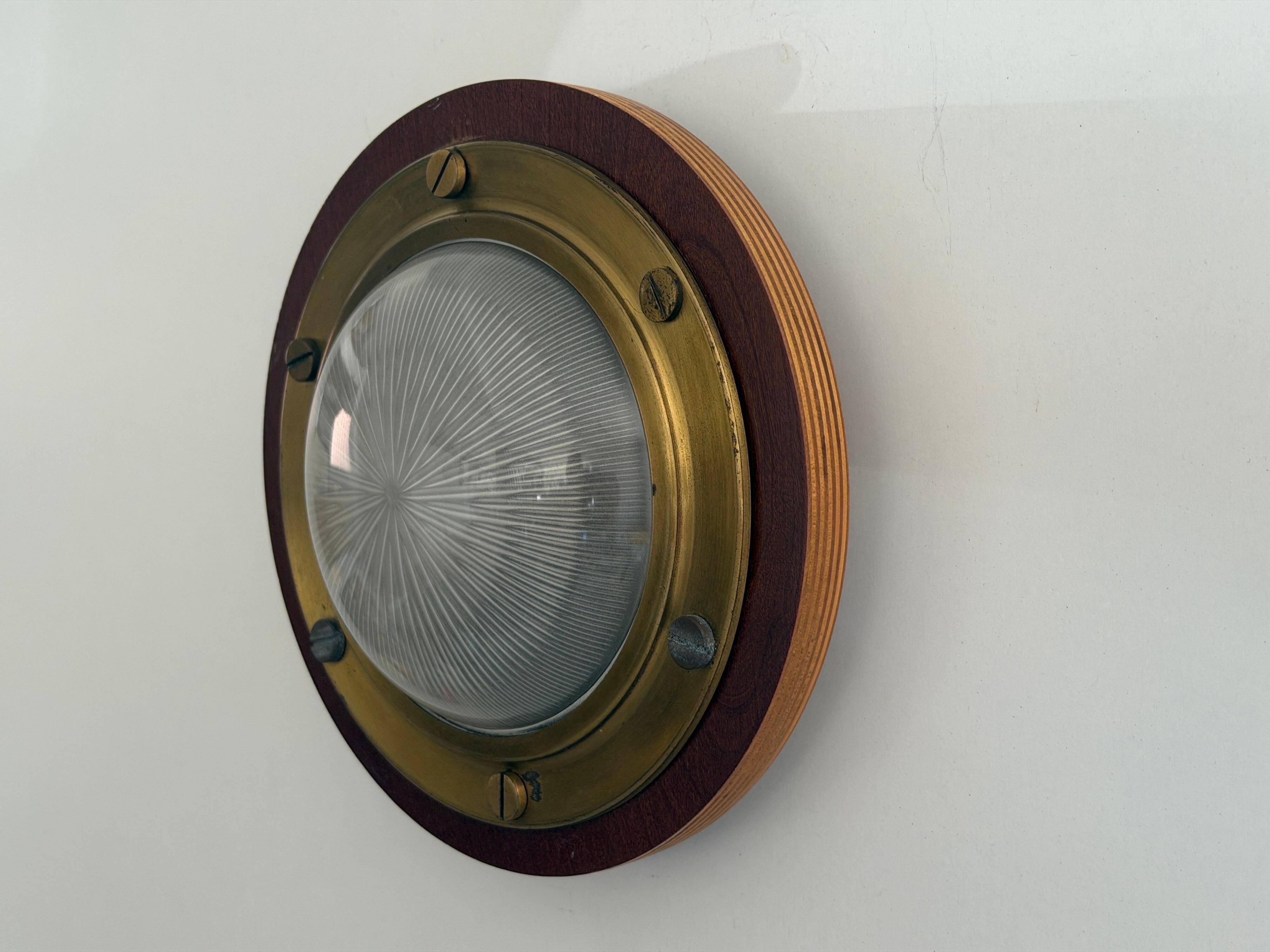 Pair of round glass wall lights, brass base and Wood Wood, 1960s, Italy.