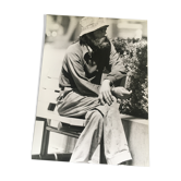 Print of a street scene. Man on a Bench, 80s