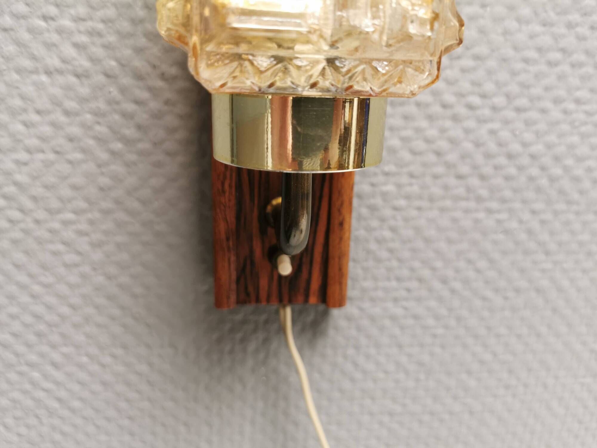 Small, stylish wall lamp with rosewood suspension and hard pressed glass