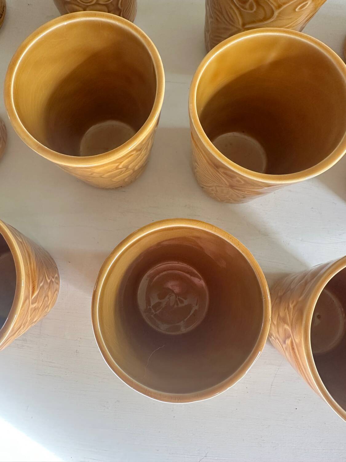 Set of 12 ochre Chavaillon de Sarreguemines cups
