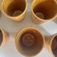 Set of 12 ochre Chavaillon de Sarreguemines cups