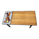 Vintage coffee table from the 1960s made of wood, enamelled lava stone, and metal.