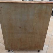 Vintage industrial metal furniture with a rusty effect, featuring two drawers on wheels.