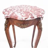 Table with a marble top, France, around 1910.