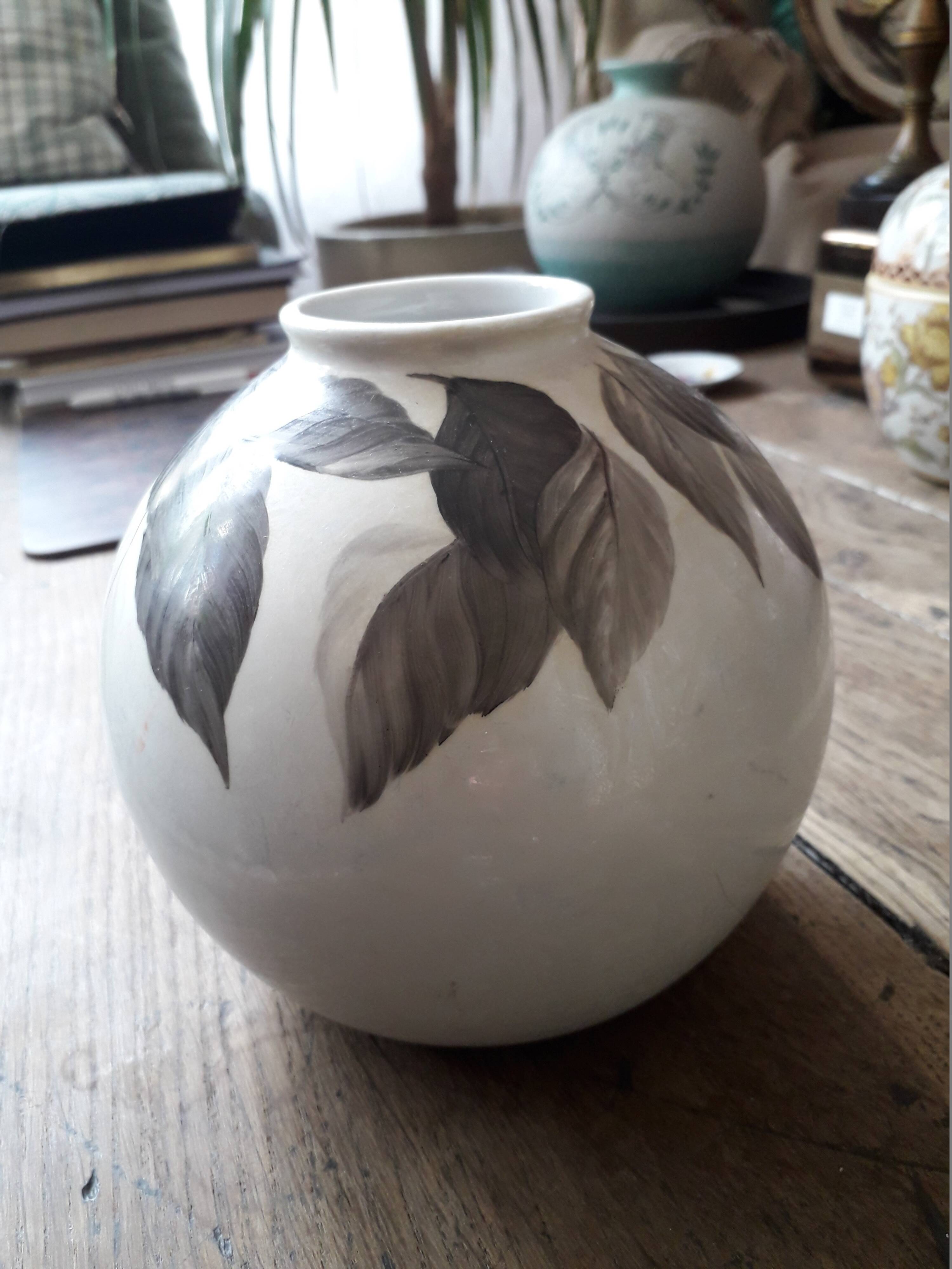 Vintage vase with plant decoration signed