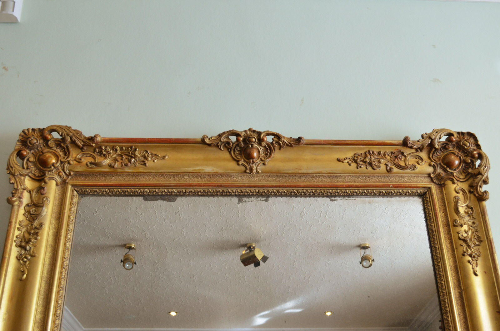 Nineteenth century monumental mirror in gilded wood