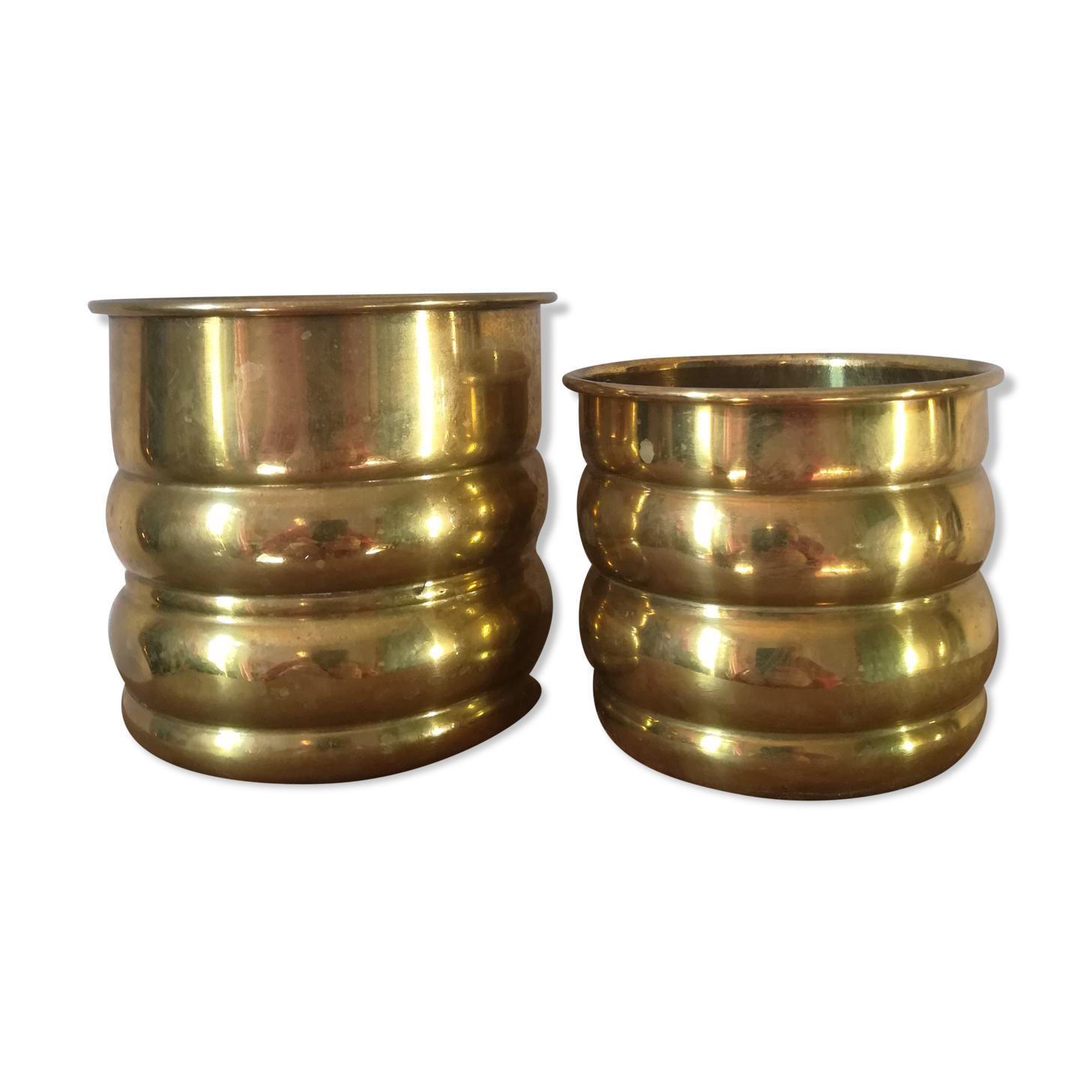 Duo of brass pot covers