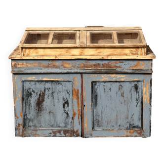 Showcase for boutique furniture, inclined boxes for presentation of collections on low sideboard