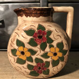 Ceramic pitcher with floral decoration signed Lucq