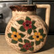Ceramic pitcher with floral decoration signed Lucq