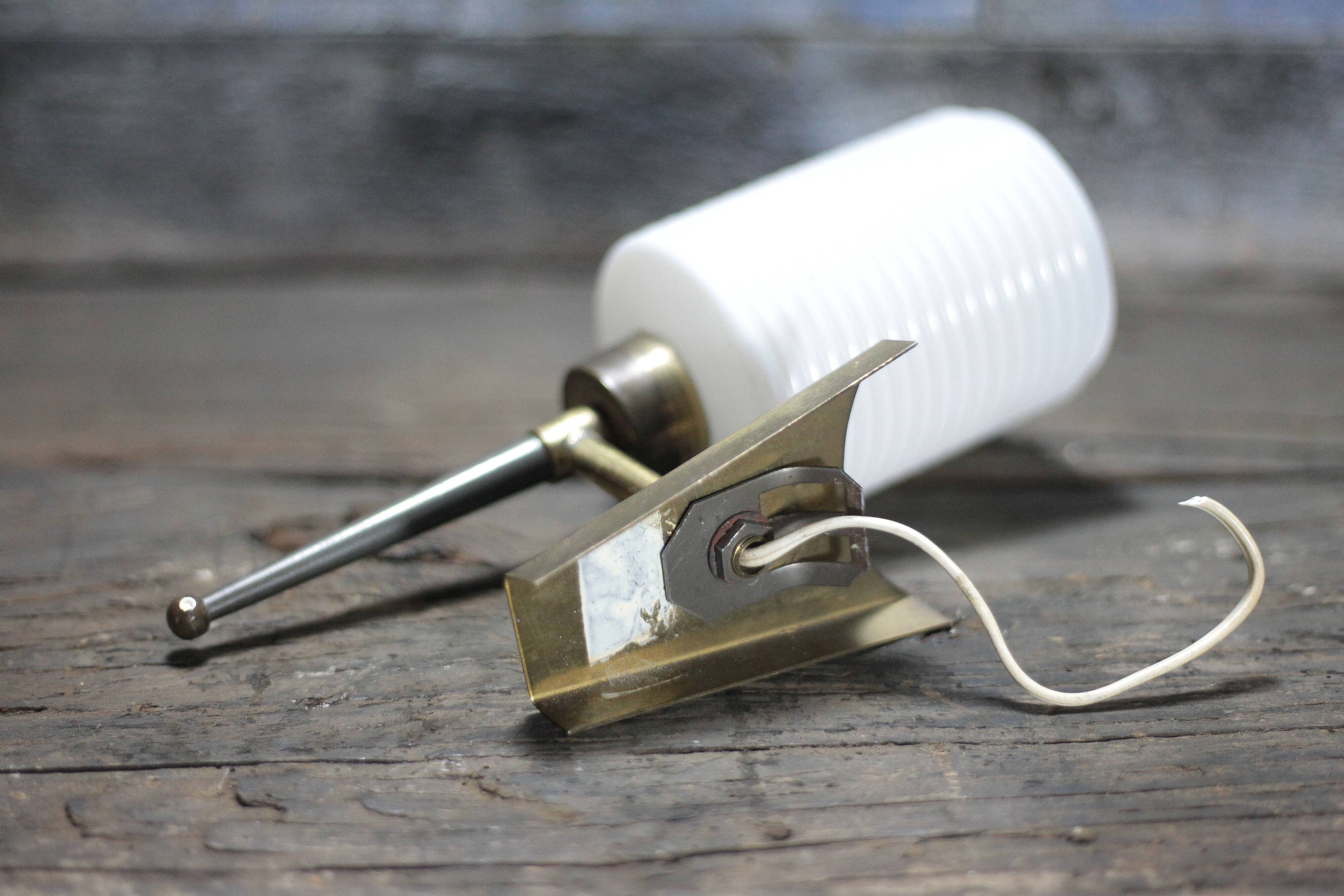 Brass wall light, black lacquered metal and white opal glass, 50s.
