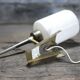Brass wall light, black lacquered metal and white opal glass, 50s.