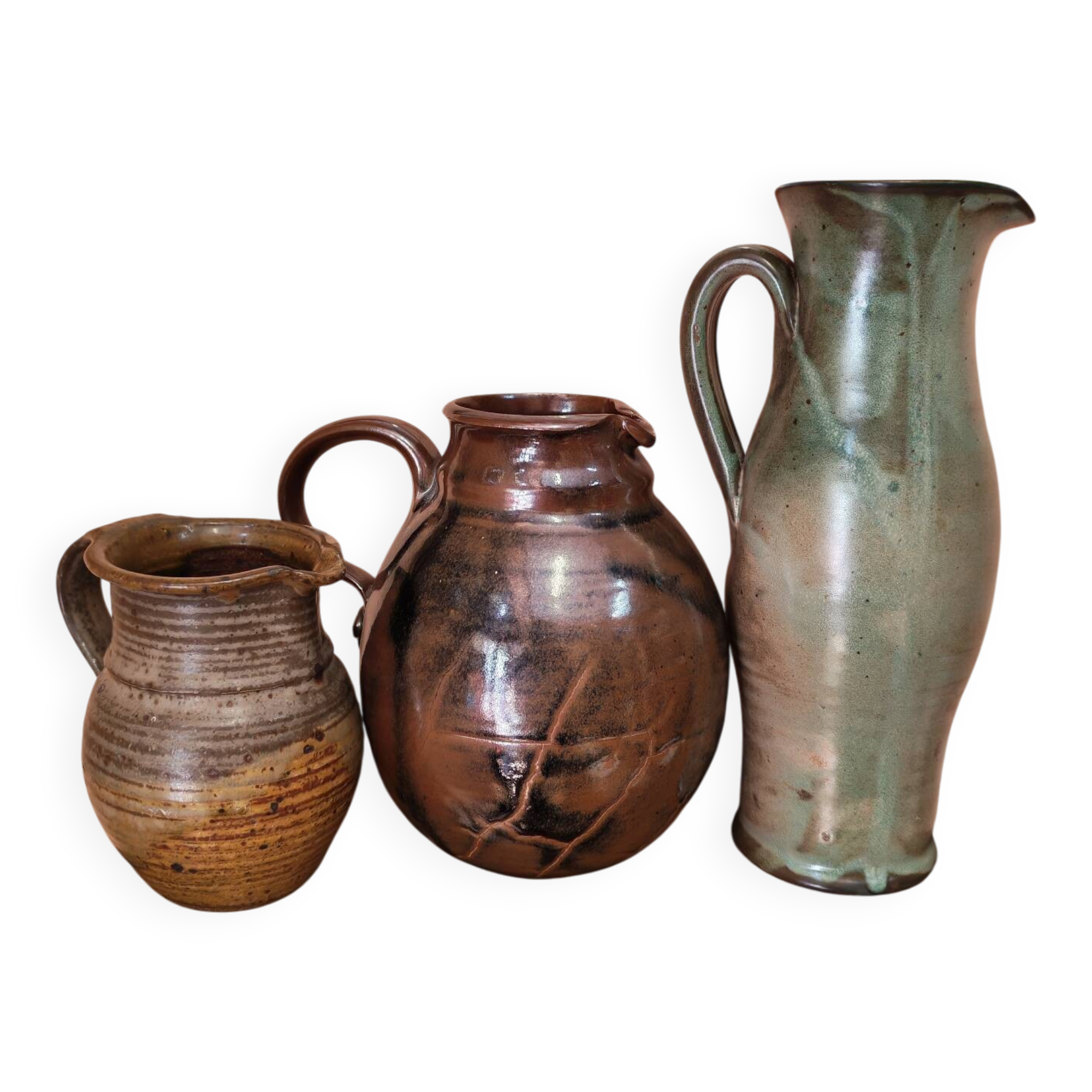 Set of three vintage ceramic jugs and a pitcher.