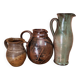 Set of three vintage ceramic jugs and a pitcher.