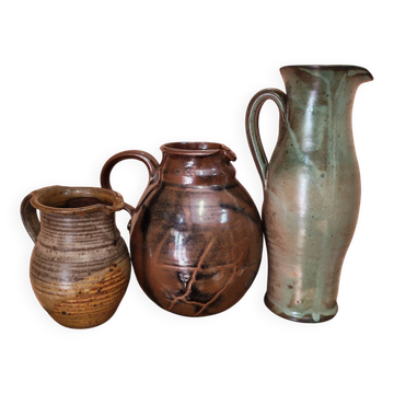 Set of three vintage ceramic jugs and a pitcher.