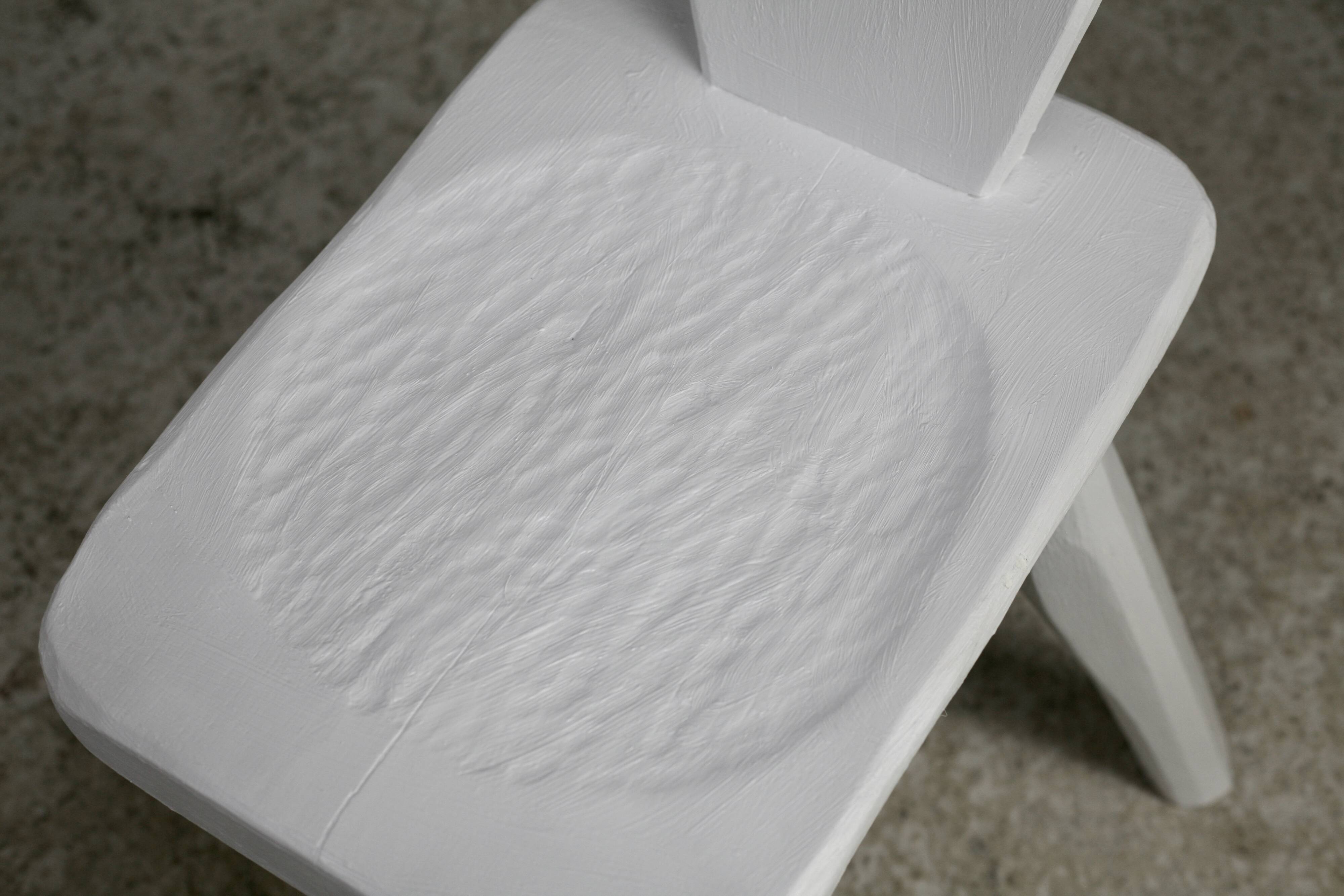 Pair of tripod chairs, gouged seats. Brutalist, circa 1960. Painted wood.