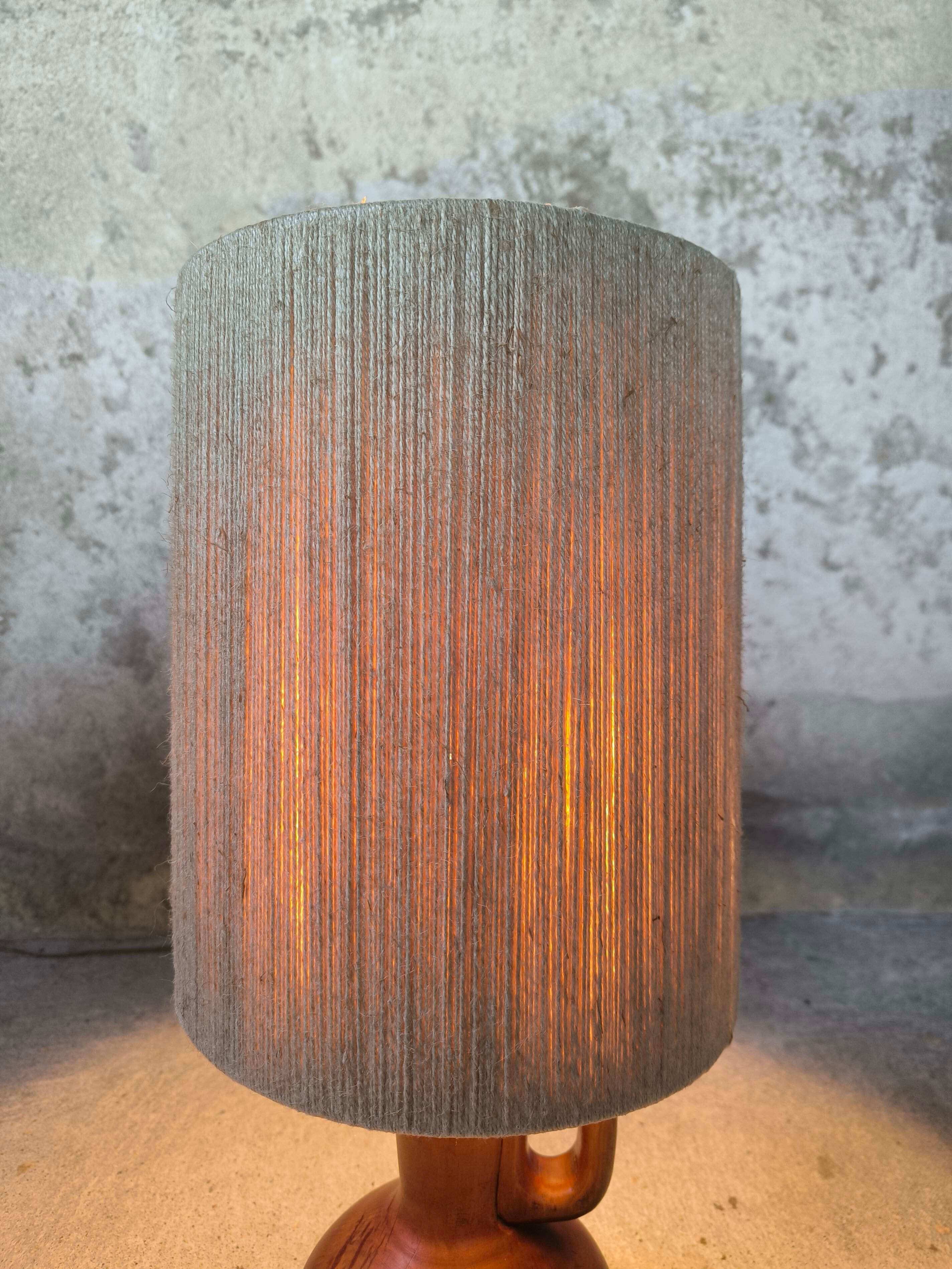 Vintage wooden table lamp with a wool shade.