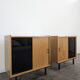 Pair of modernist sideboards with black glass doors in oak veneer.