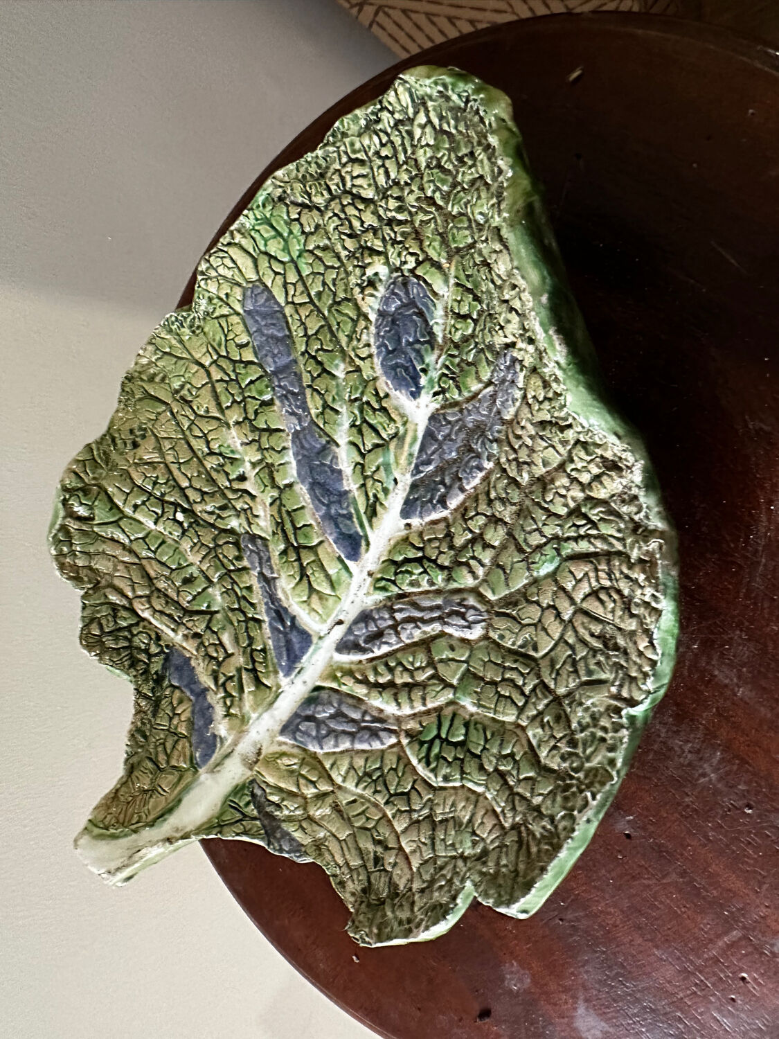 Vintage ceramic leaf-shaped vide poche, signed.