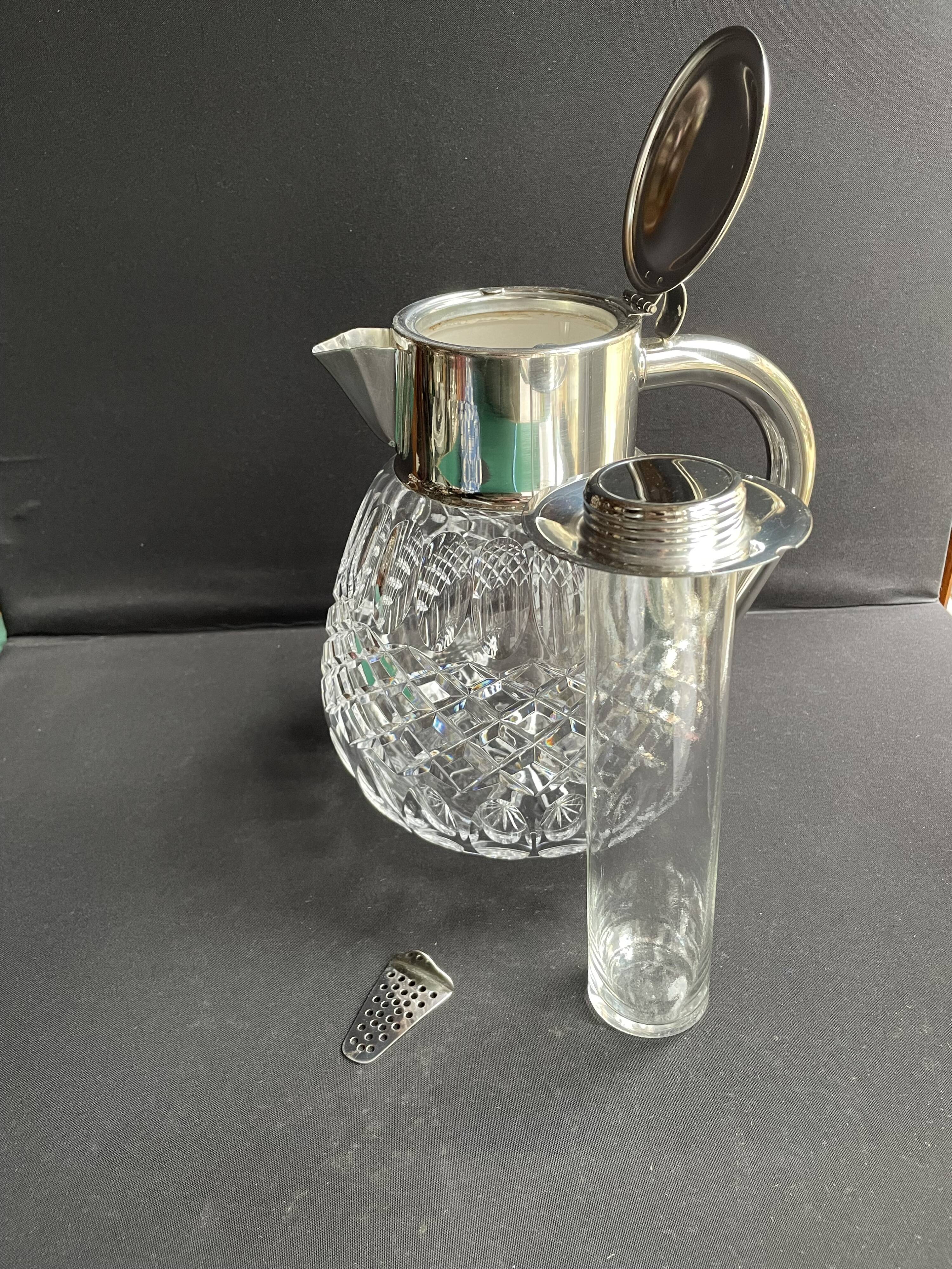 Important jug with ice reserve in cut crystal and silver-plated metal