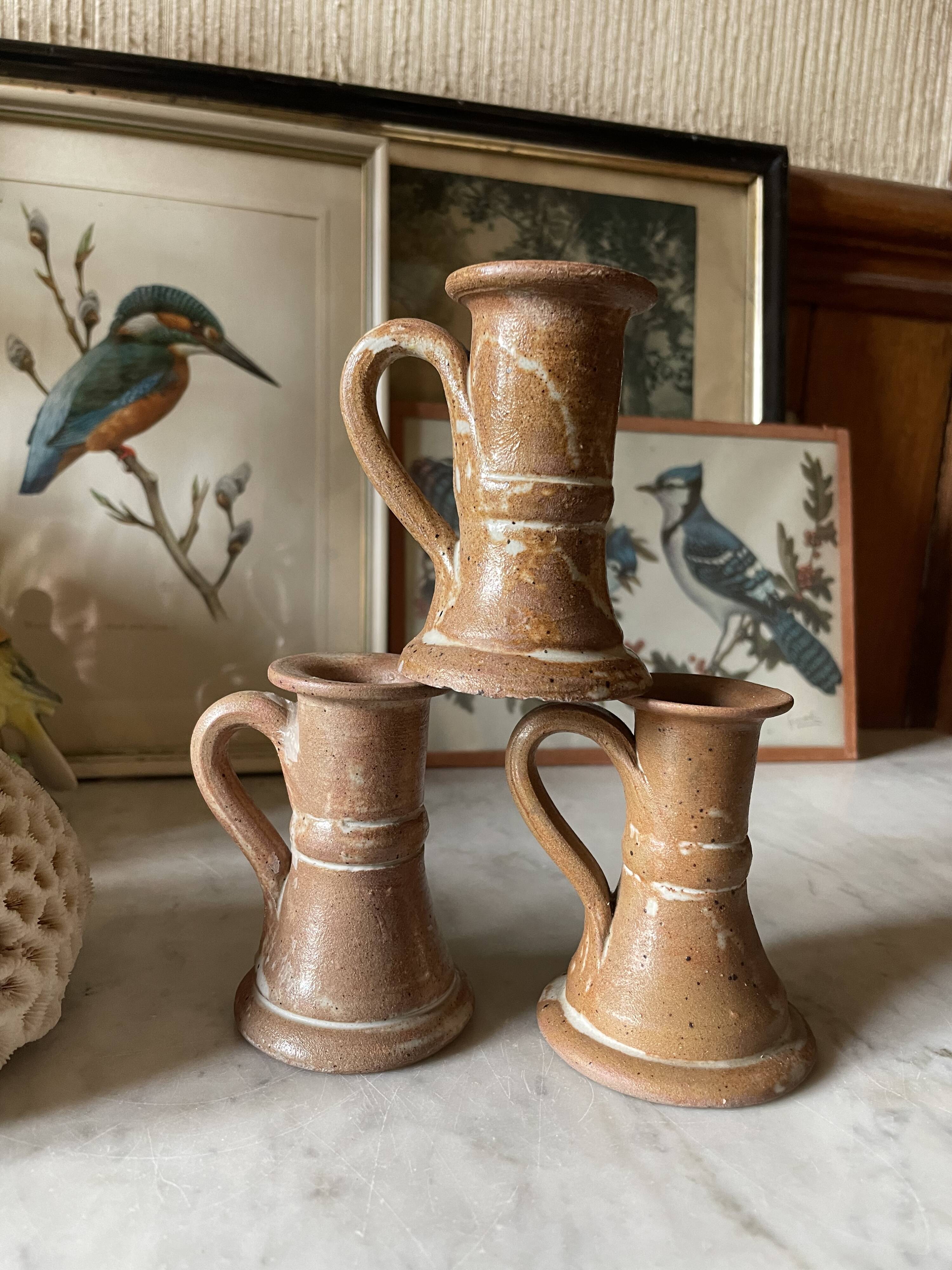 Trio of stoneware candle holders