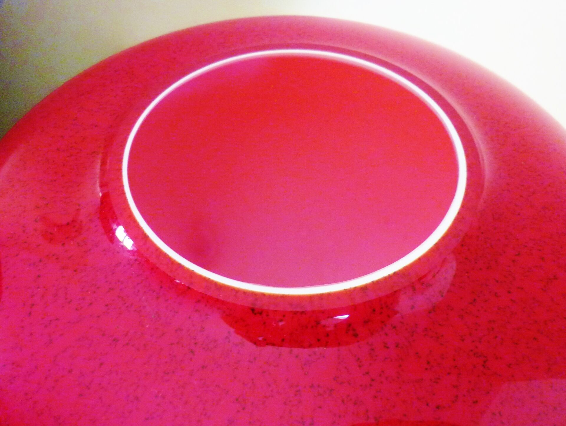 Pot-bellied, art deco vase in speckled ruby red multi-layered glass, white interior