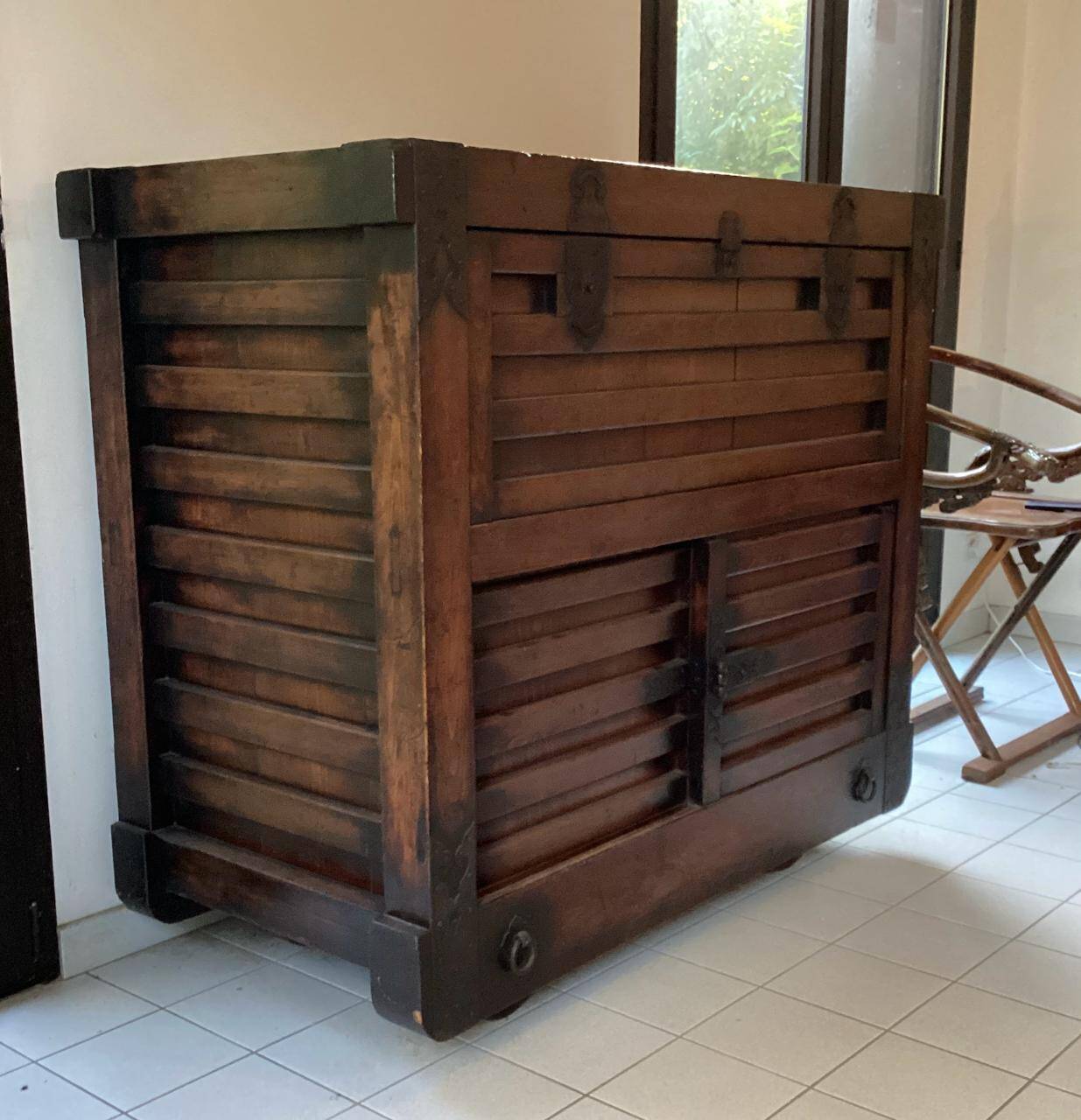 Japanese antique wooden chest with black fittings.