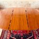 Expandable teak dining table, butterfly extension, circa 60s