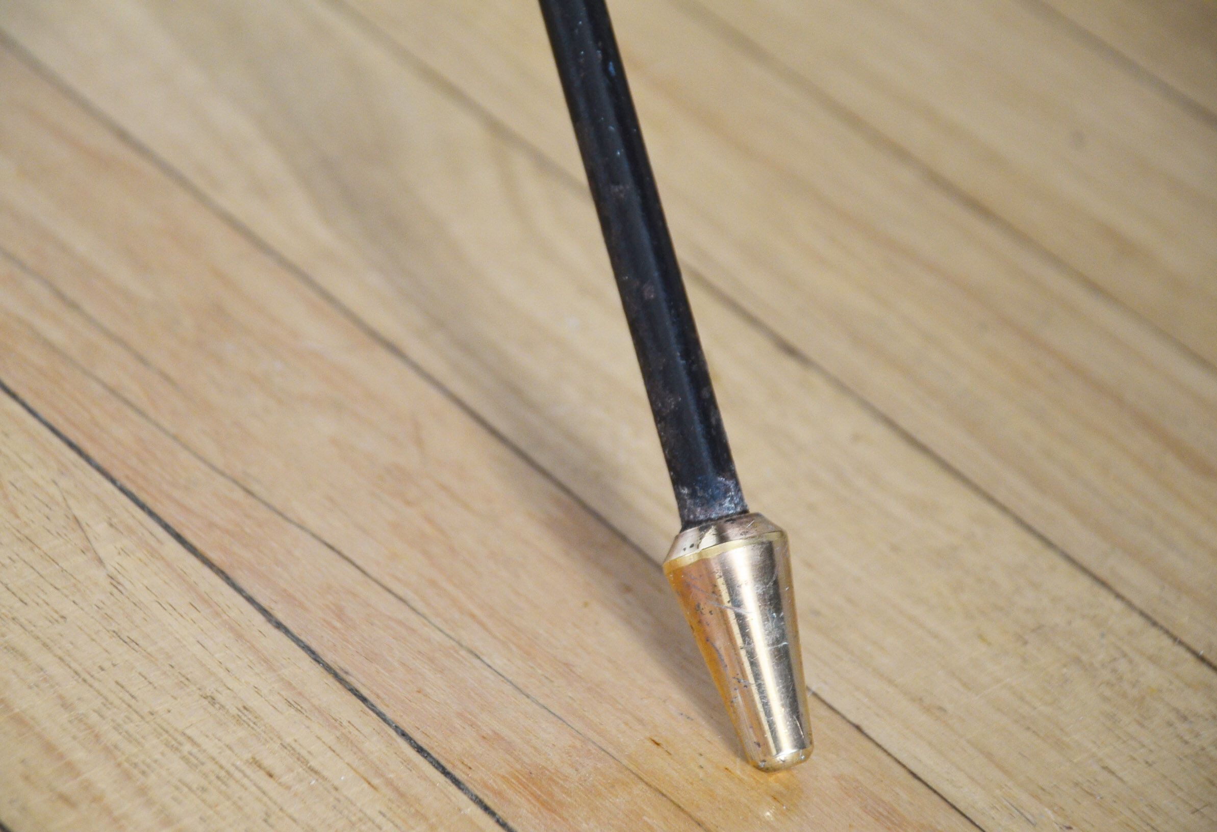 Black glass and brass coffee table in the 1960s