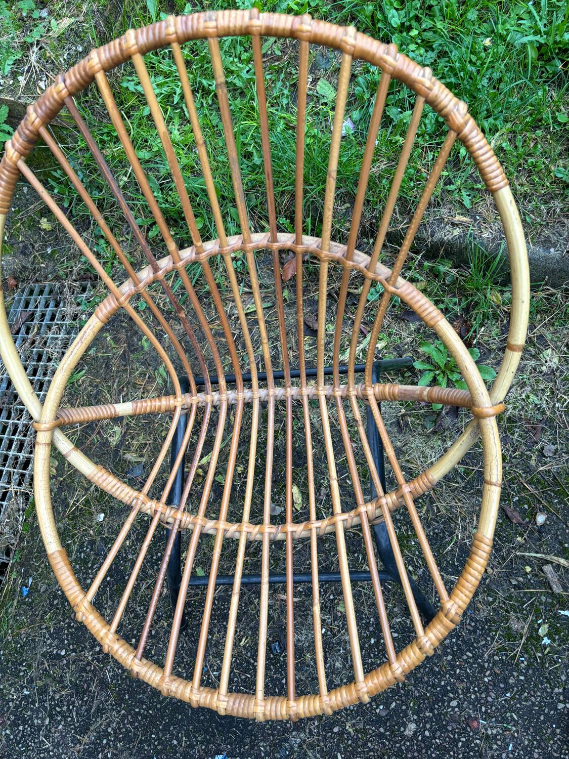 Vintage rattan armchair with metal legs