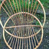 Vintage rattan armchair with metal legs