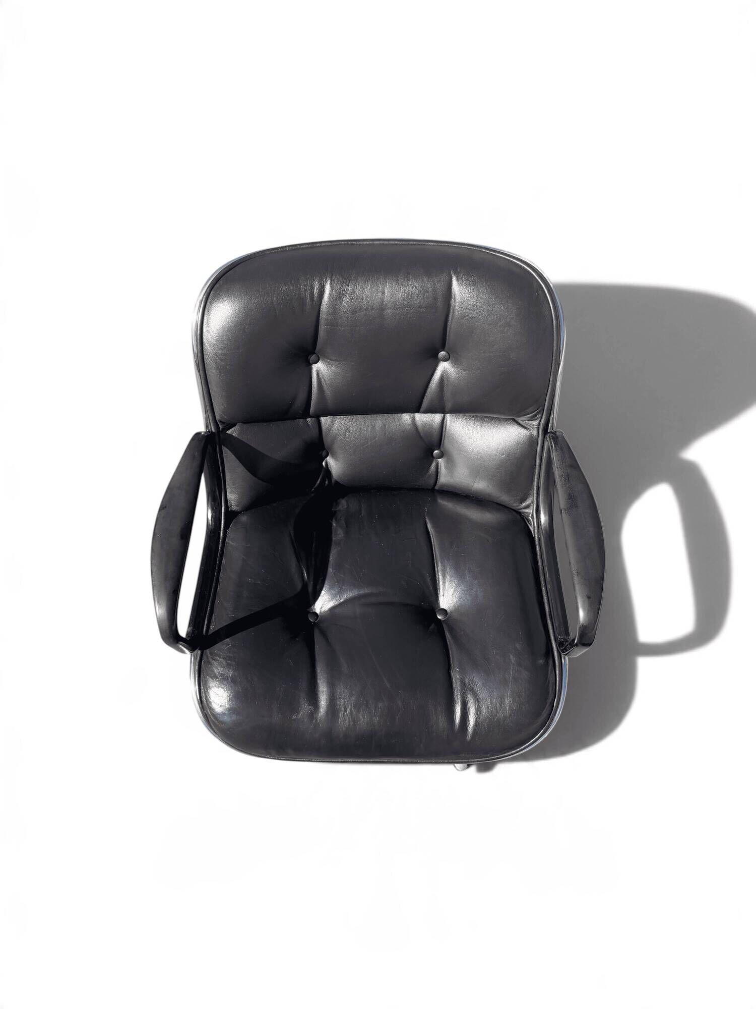 Charles Pollock Executive Knoll office chair in black leather.