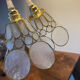 Pair of portable lamps with mother-of-pearl lampshades and brass.