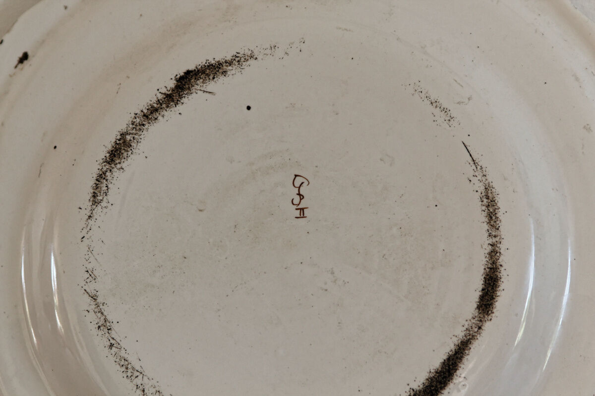 Signed Moustiers plate, in yellow shades