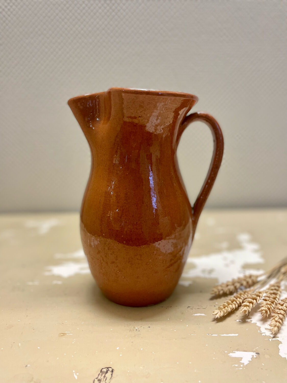 Vintage glazed terracotta pitcher