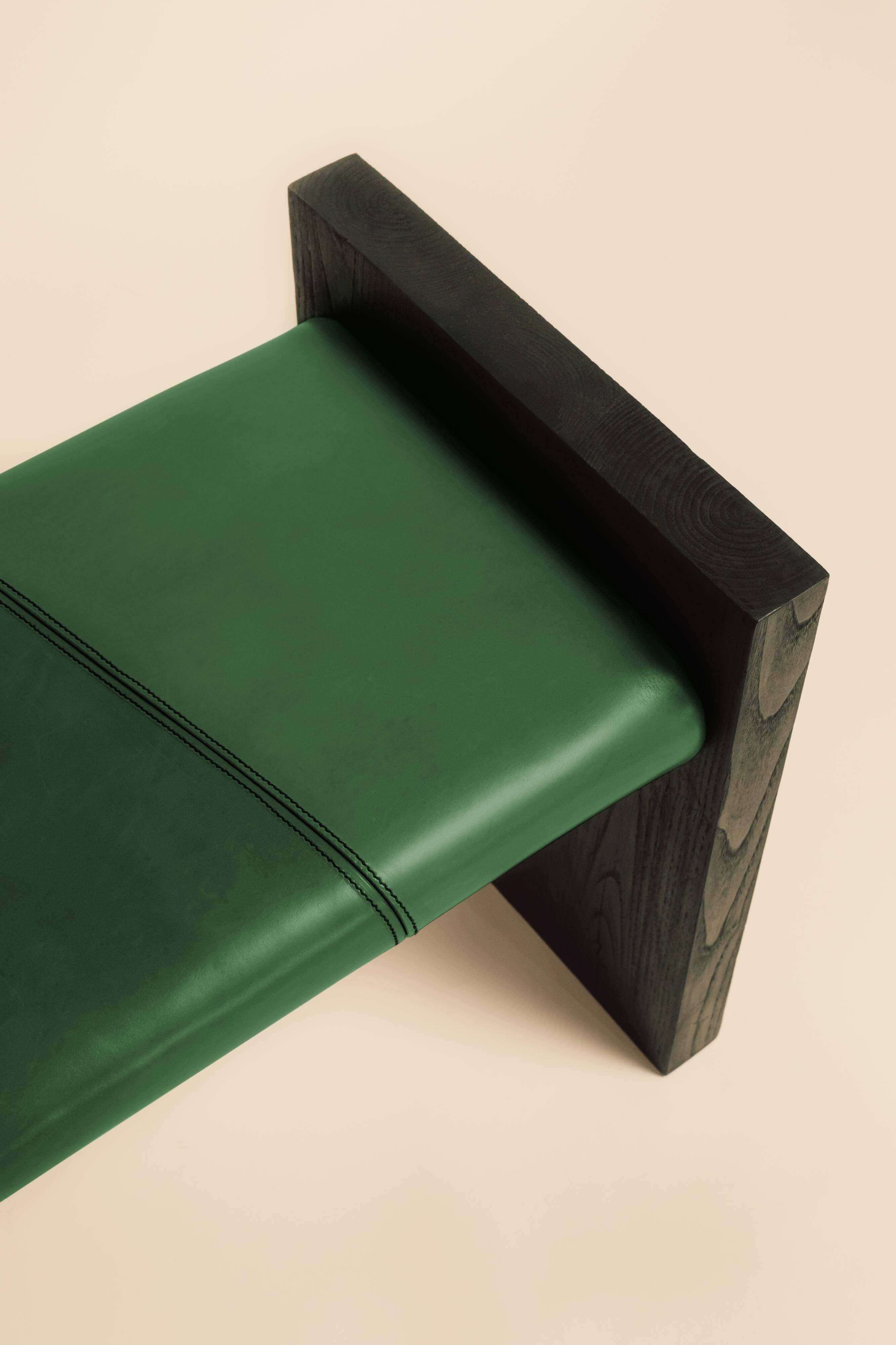 Maërl bench, sepia model, ebonized chestnut and green leather