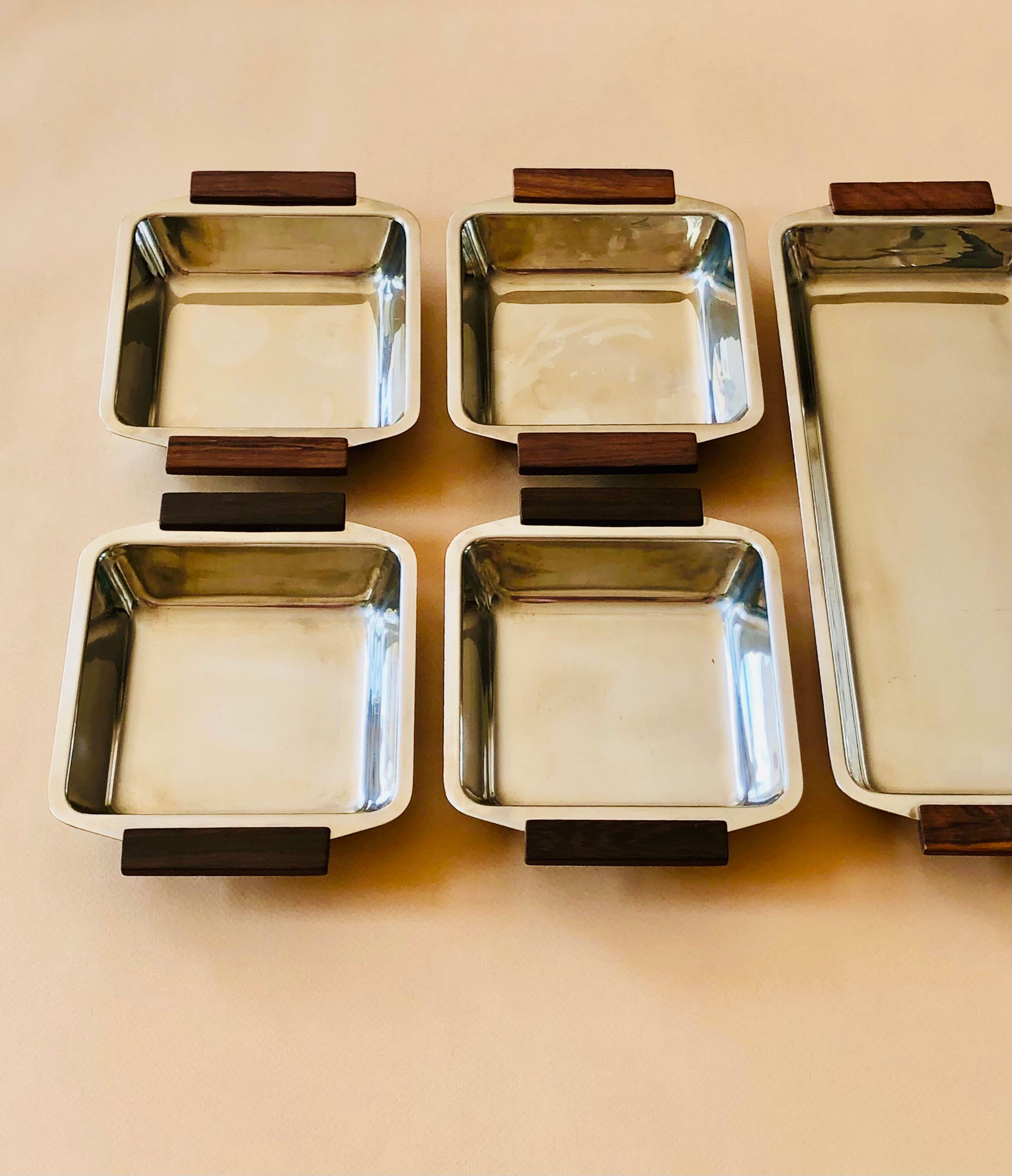 Service of Scandinavian dishes in stainless steel and teak 1970