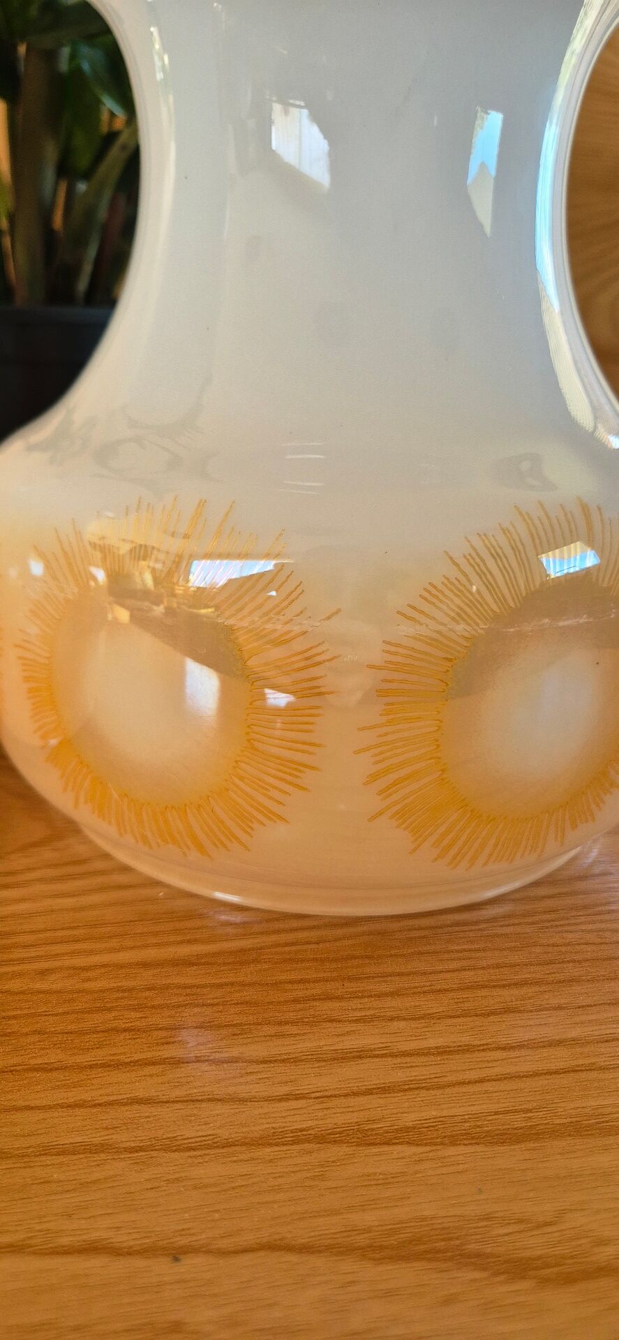 2 vintage pendant lights in white opaline with orange patterns and chrome.