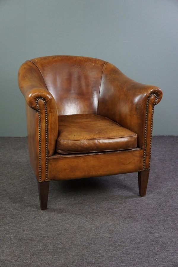 Club chair in patinated sheepskin