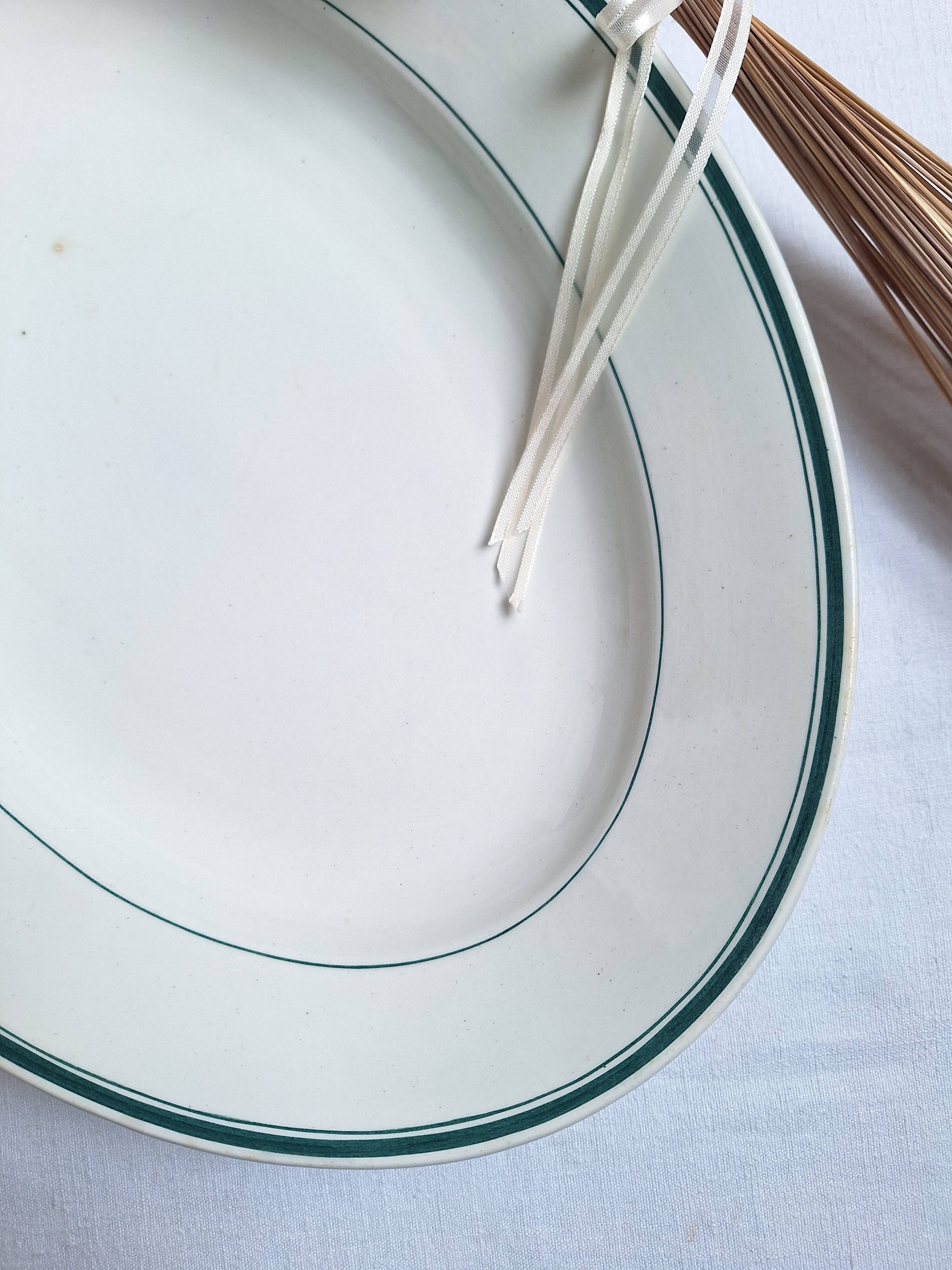 Green oval shallow dish from Moulin des Loups