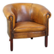 Fauteuil club en peau de mouton subtile avec finition cloutée décorative