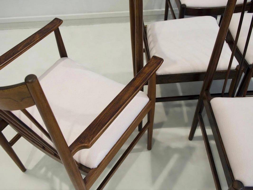 Set of six wooden dining chairs Arne Vodder Model No 422 with fabric upholstery.